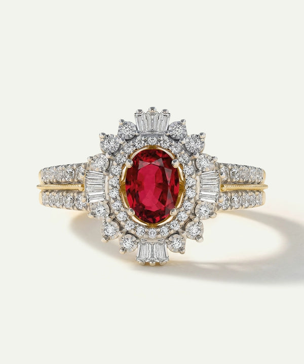 Elegant ring with a red gemstone and diamond accents on a white background