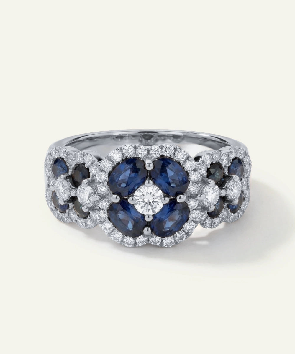 Elegant ring with blue gemstones and diamonds on a white background