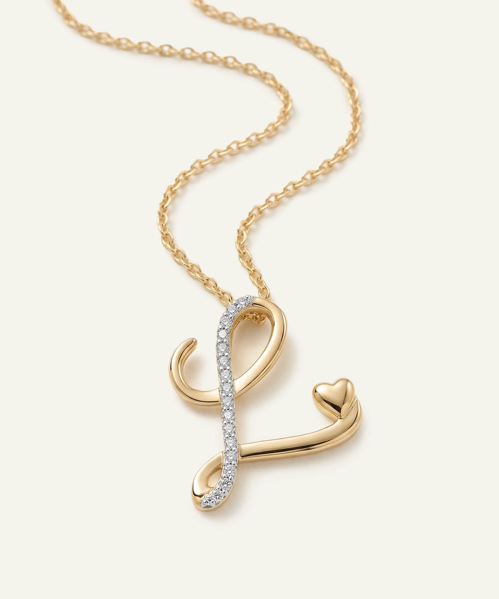 Gold necklace with a unique pendant on a light beige background