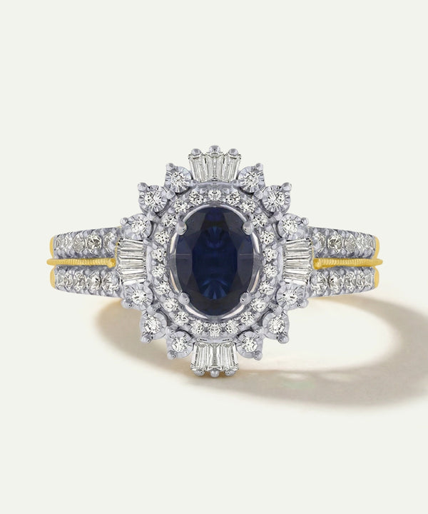 Elegant ring with a blue gemstone and diamond accents on a white background