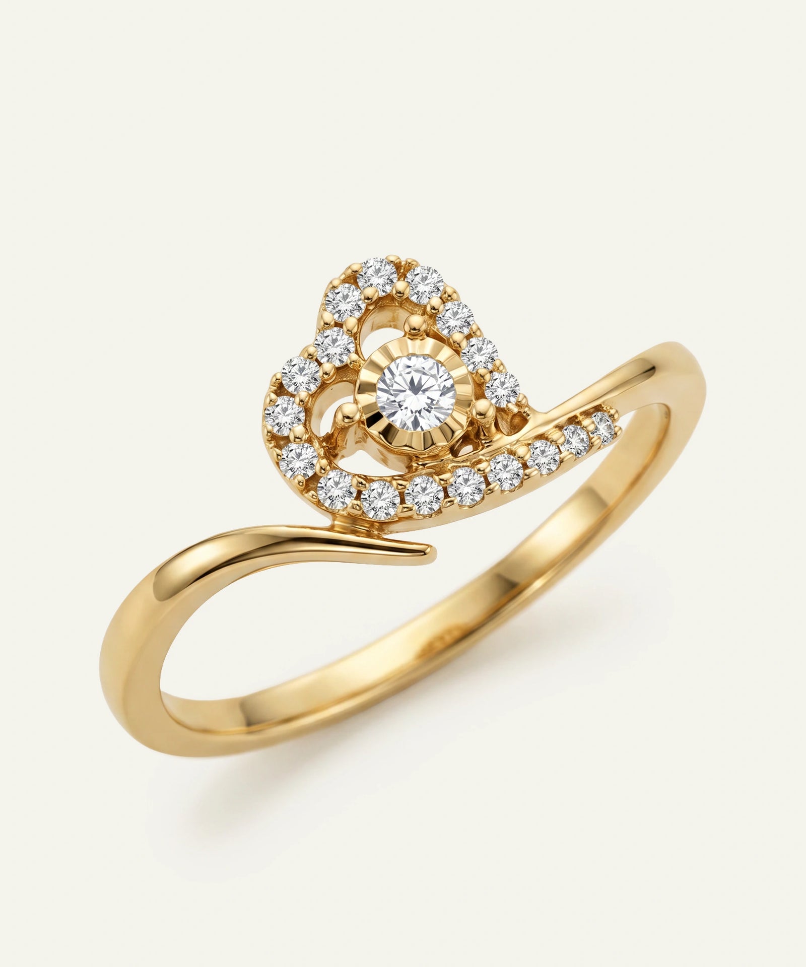 Gold ring with a diamond on a white background