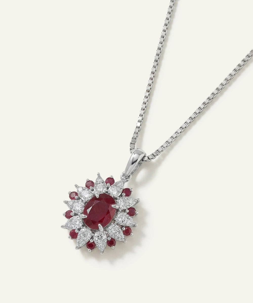 Diamond and ruby pendant on a white background