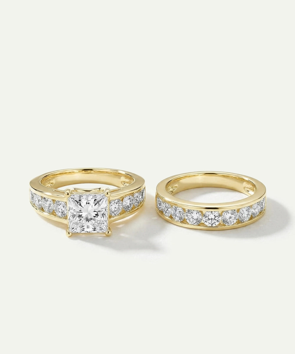 Two gold rings with diamond accents on a light gray background