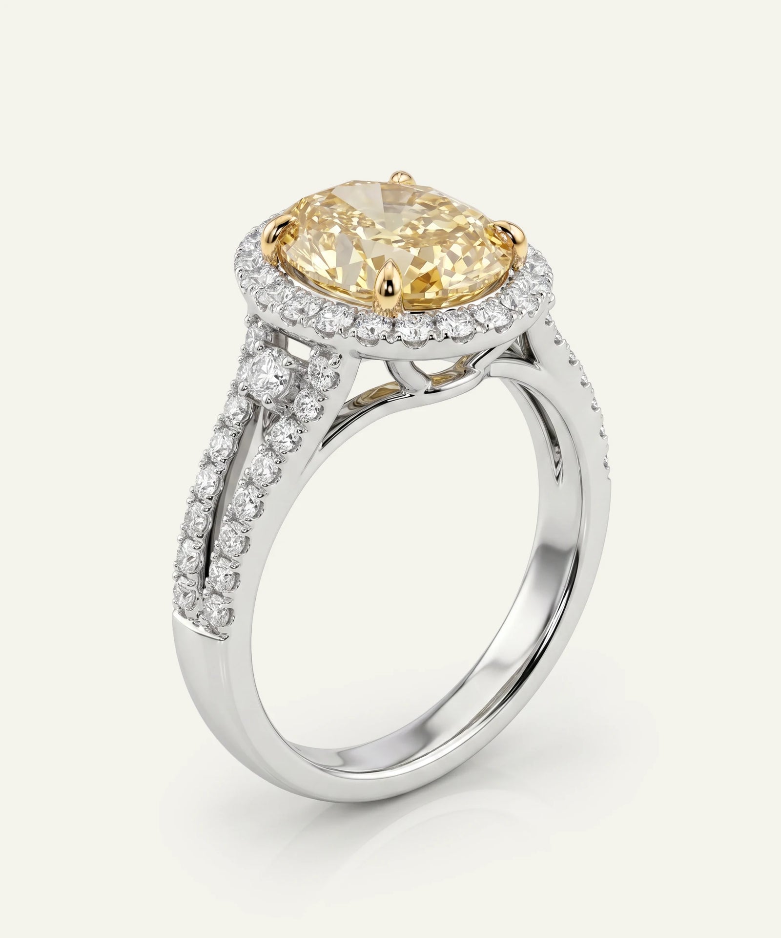 Diamond ring with a yellow gemstone on a white background