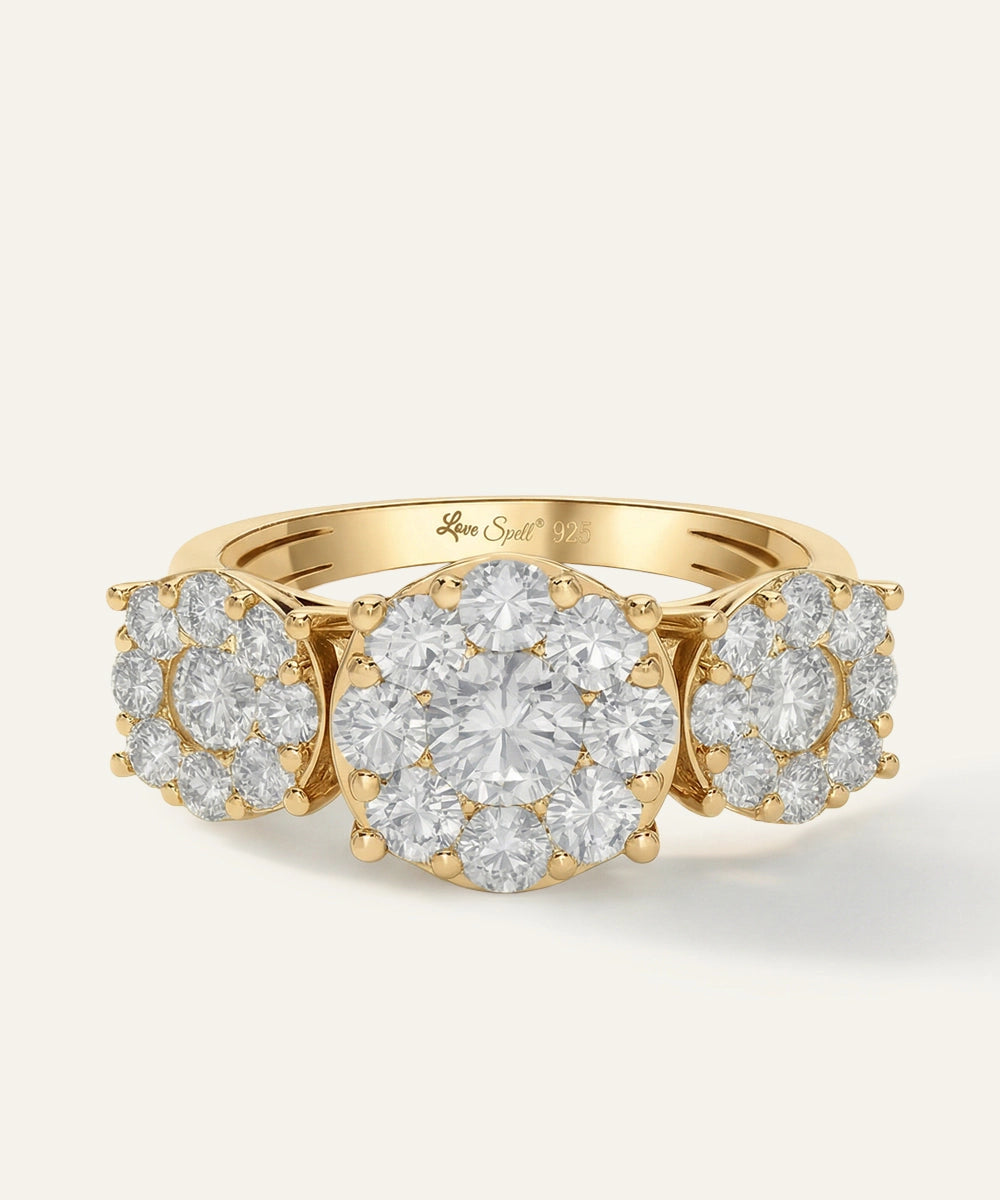 Gold ring with diamond clusters on a light beige background