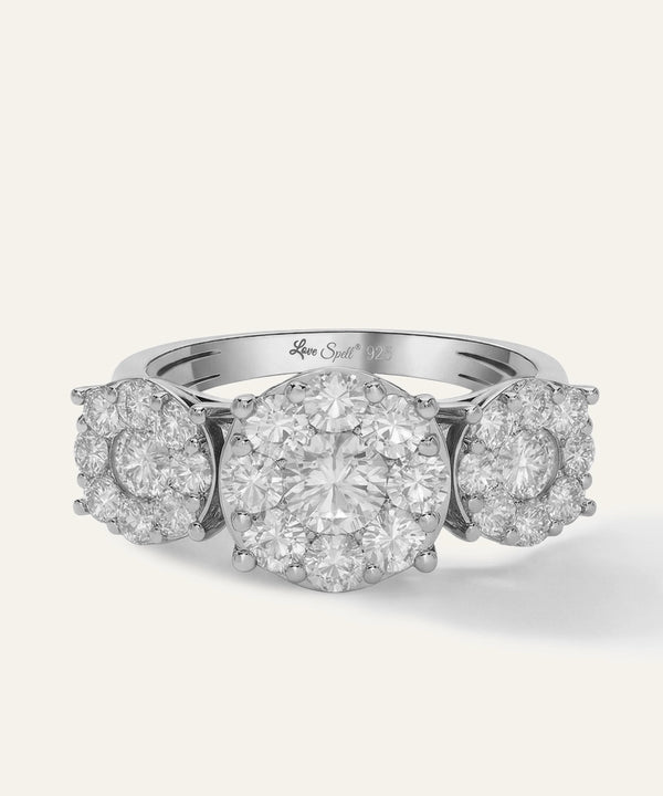 Diamond ring with three round diamonds on a white background