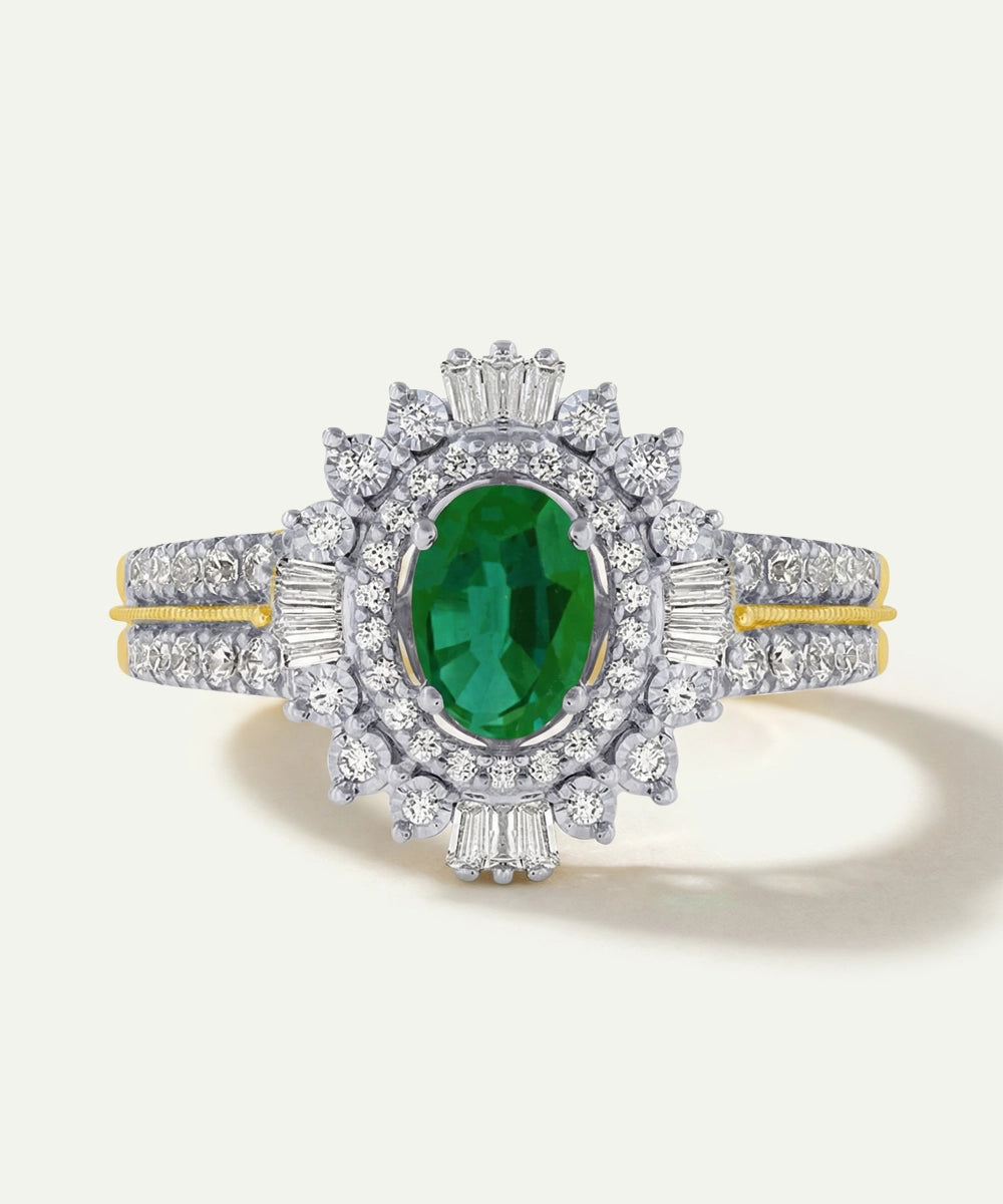 Elegant ring with a green gemstone and diamond accents on a white background