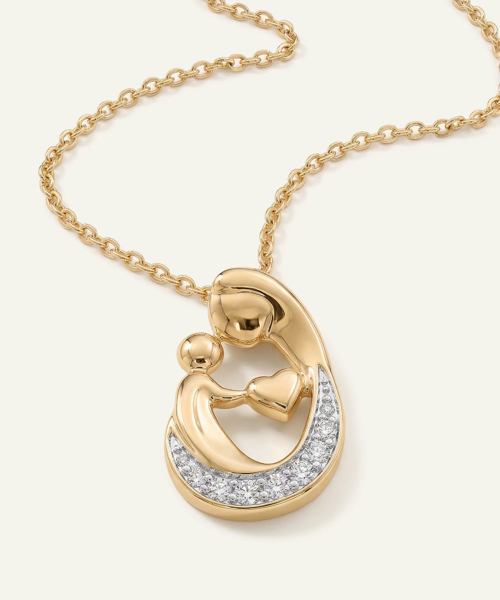 Gold necklace with a heart-shaped pendant on a white background