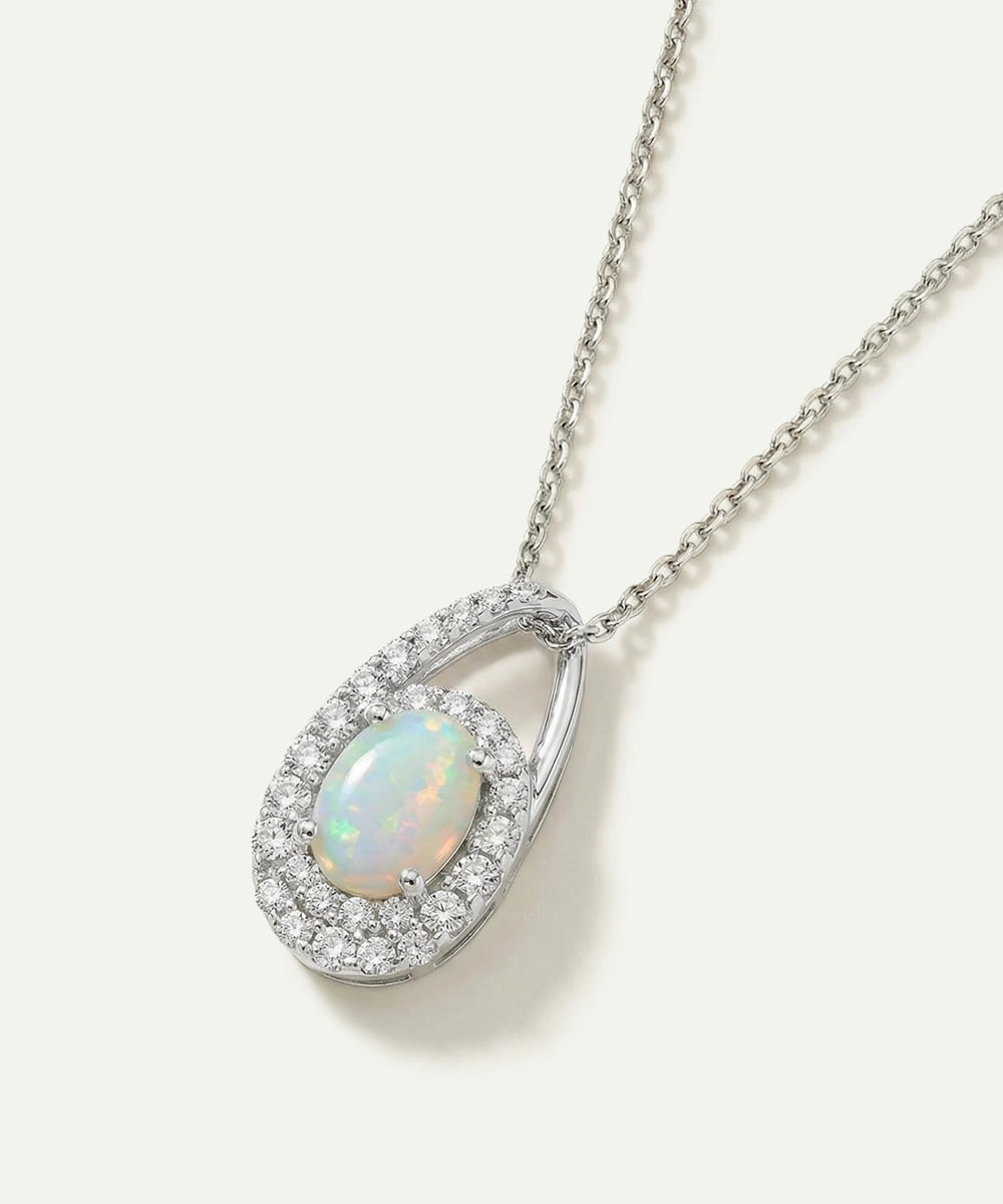 Opal pendant necklace with chain on a white background