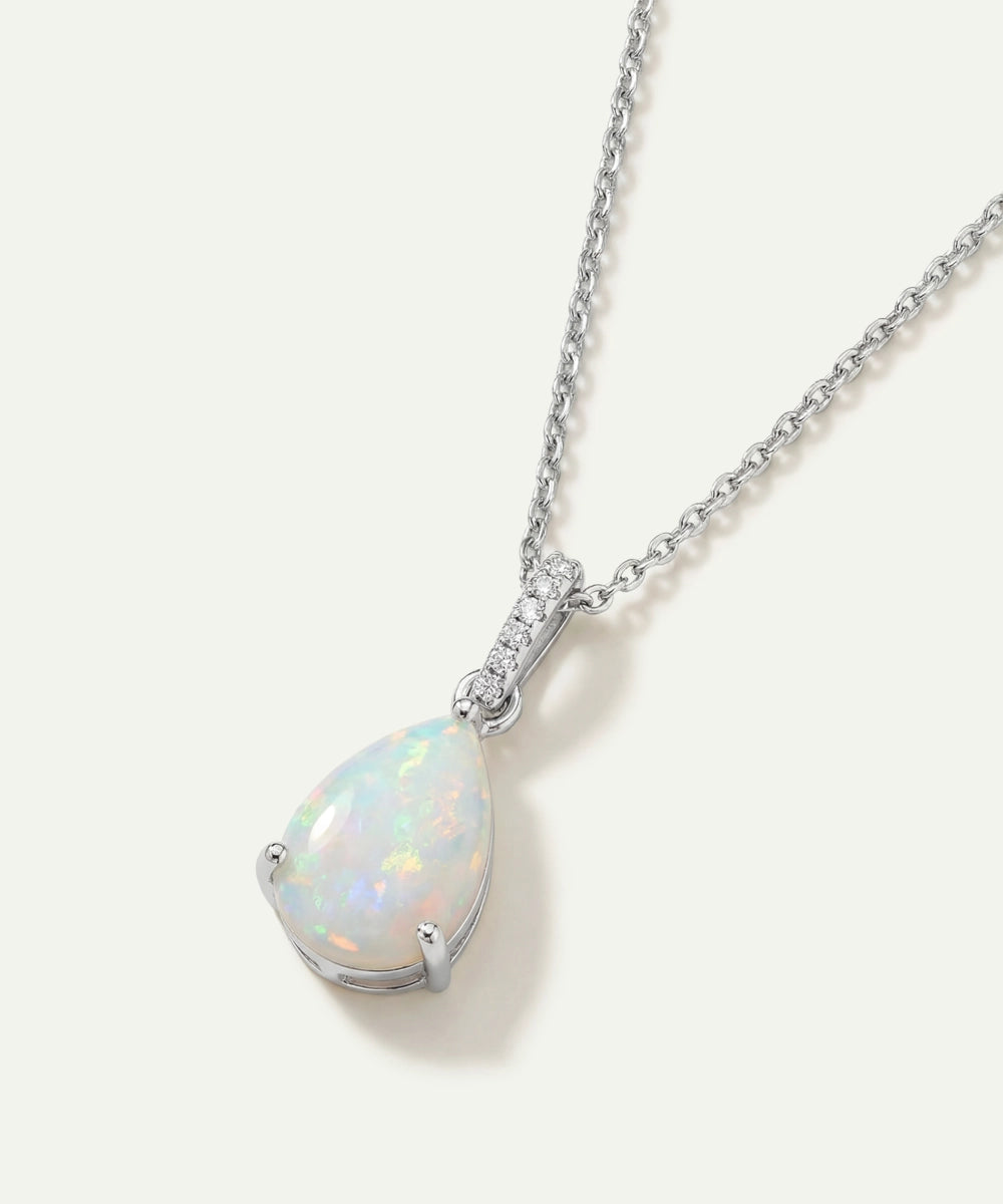 Opal pendant necklace on a white background