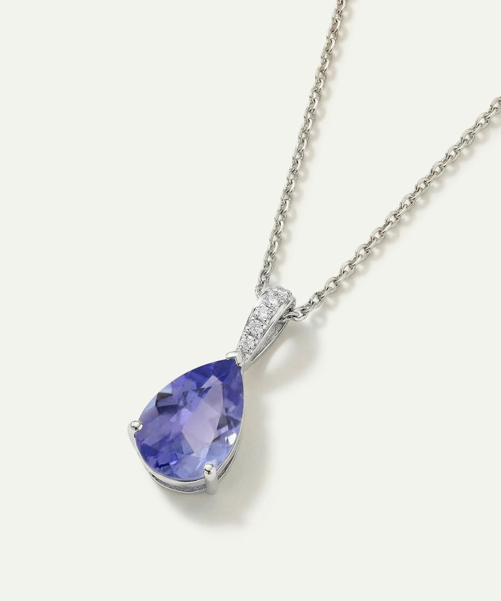 Purple teardrop-shaped gemstone necklace on a white background