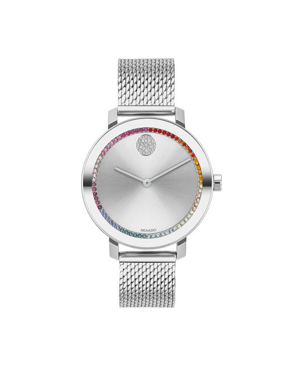 Silver watch with a colorful gemstone-studded face on a white background