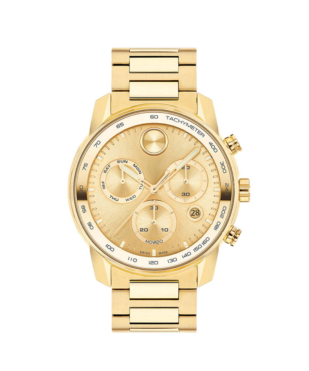 Gold wristwatch with detailed face on a white background