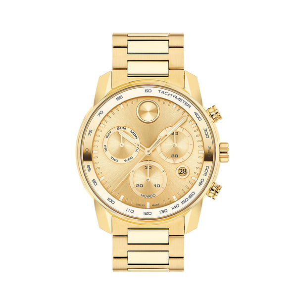 Gold wristwatch with detailed face on a white background