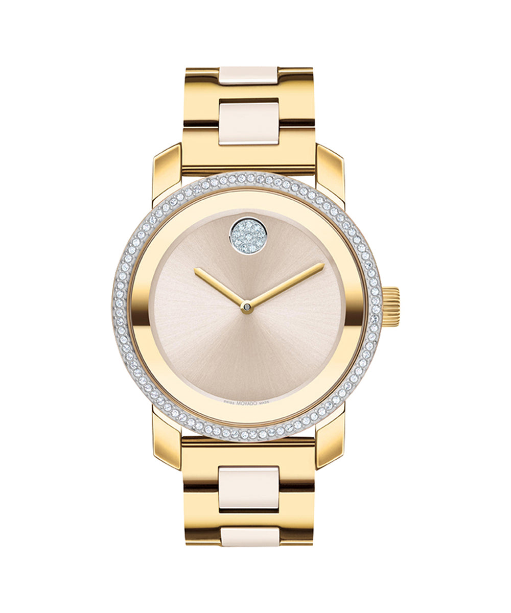 Gold wristwatch with a beige face on a white background