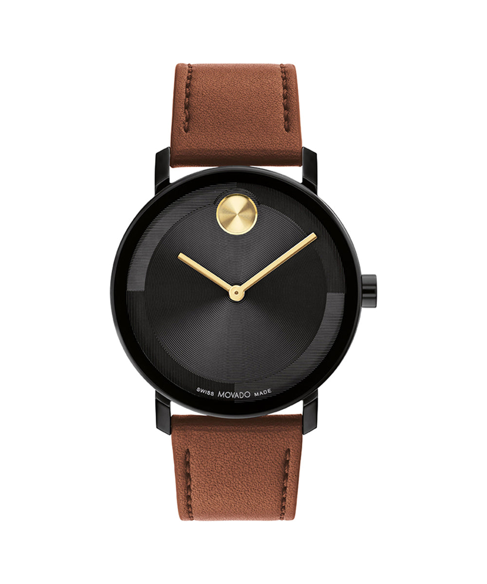 Watch with black face, gold hands, and brown leather strap on a white background