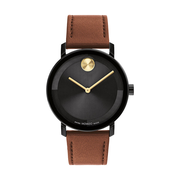 Watch with brown leather strap and black dial on a white background