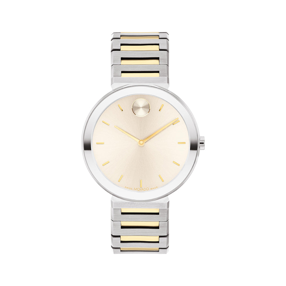 Silver and gold watch with a white face on a white background
