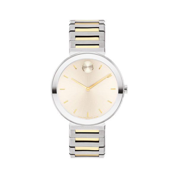 Silver and gold watch with a white face on a white background