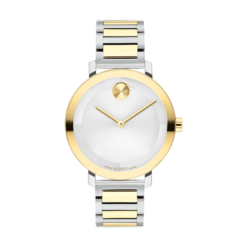 Two-tone gold and silver watch with white face on a white background