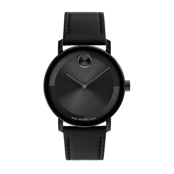 Black watch with leather strap on a white background
