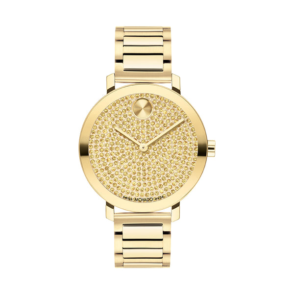 Gold wristwatch with a detailed face on a white background