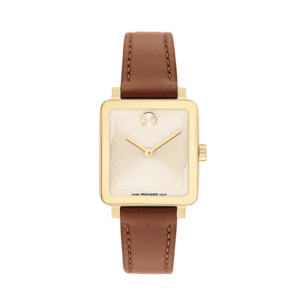 Gold watch with a brown leather strap on a white background