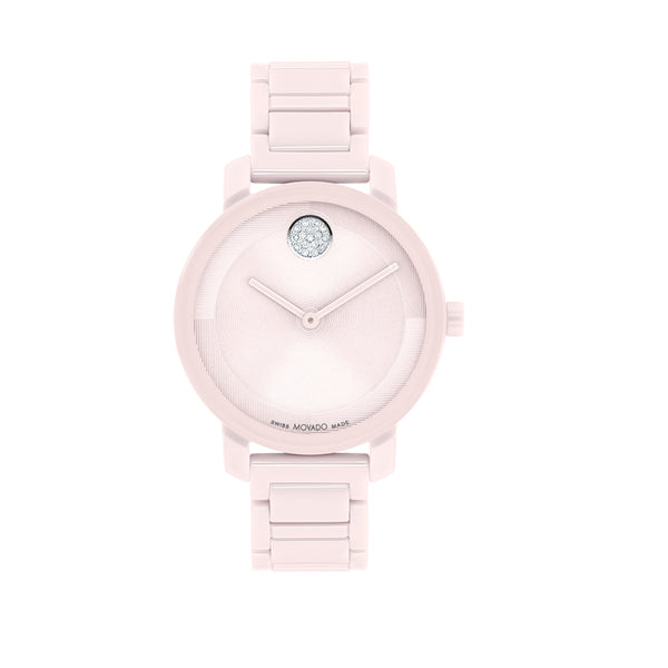 Pink watch with a diamond on the face against a white background