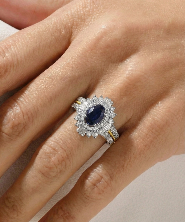 Elegant ring with a blue gemstone and diamond halo on a hand against a neutral background