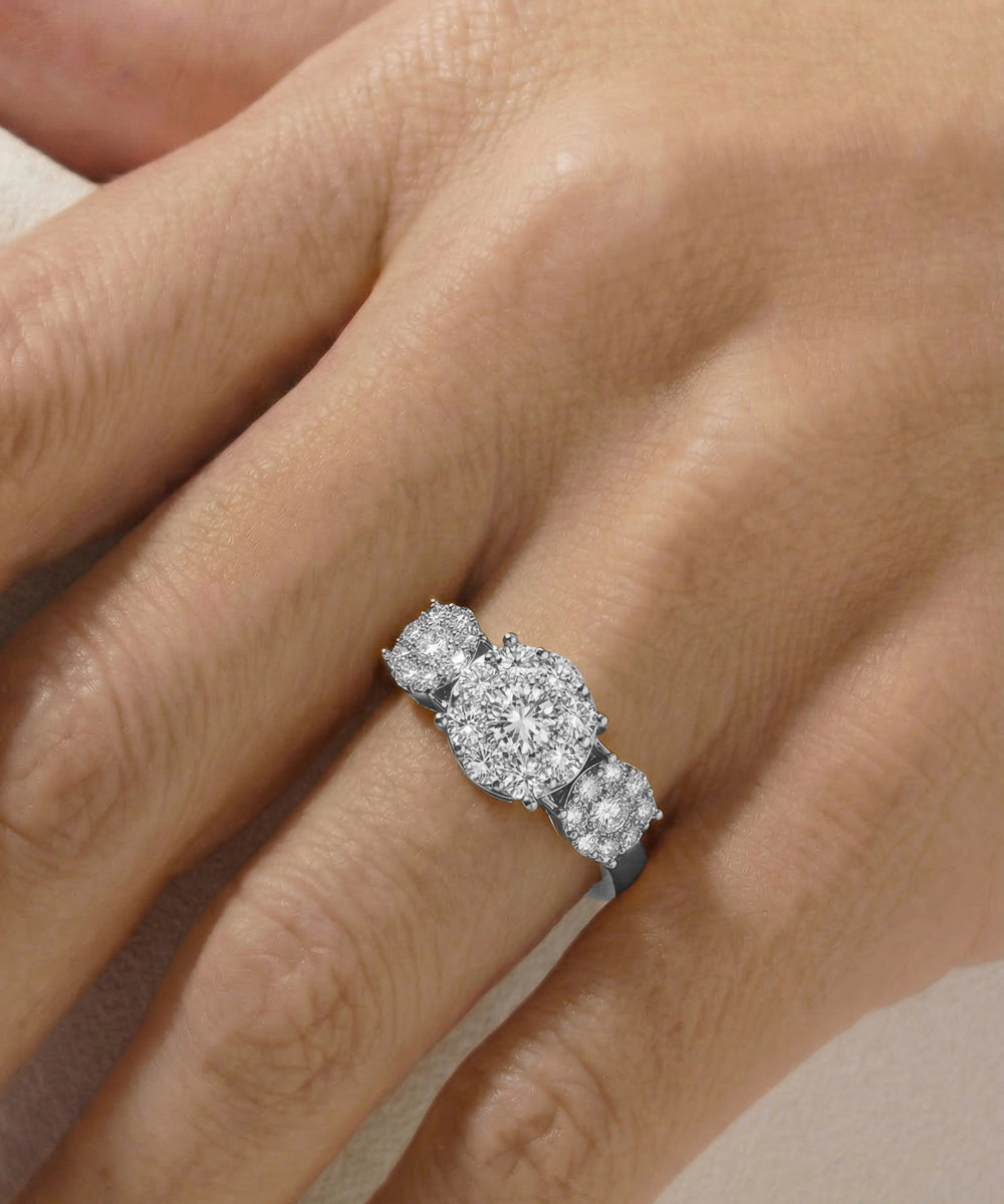 Diamond ring on a person's finger with a neutral background
