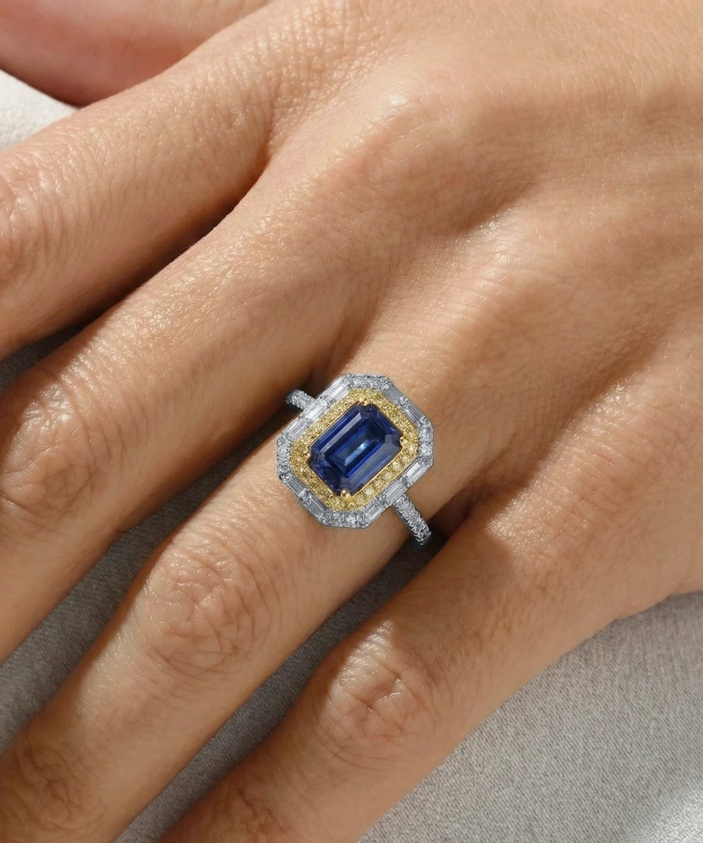 Ring with a blue gemstone on a person's finger