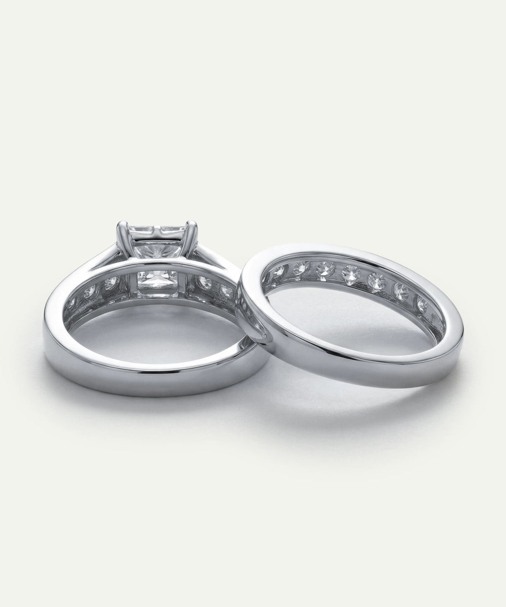 Two silver rings with diamond accents on a white background