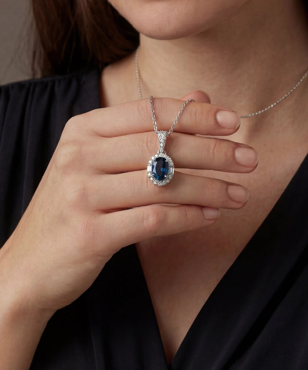 Love Spell® Lab-grown Diamond and Blue Topaz Halo Pendant - 0.15 Ct. T.W.