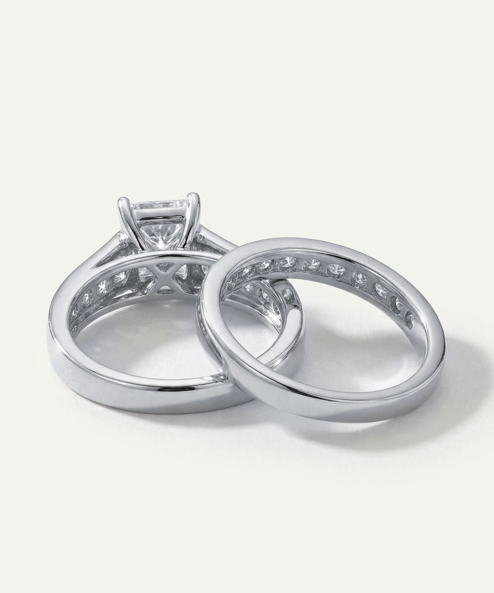 Two silver rings with diamond accents on a white background