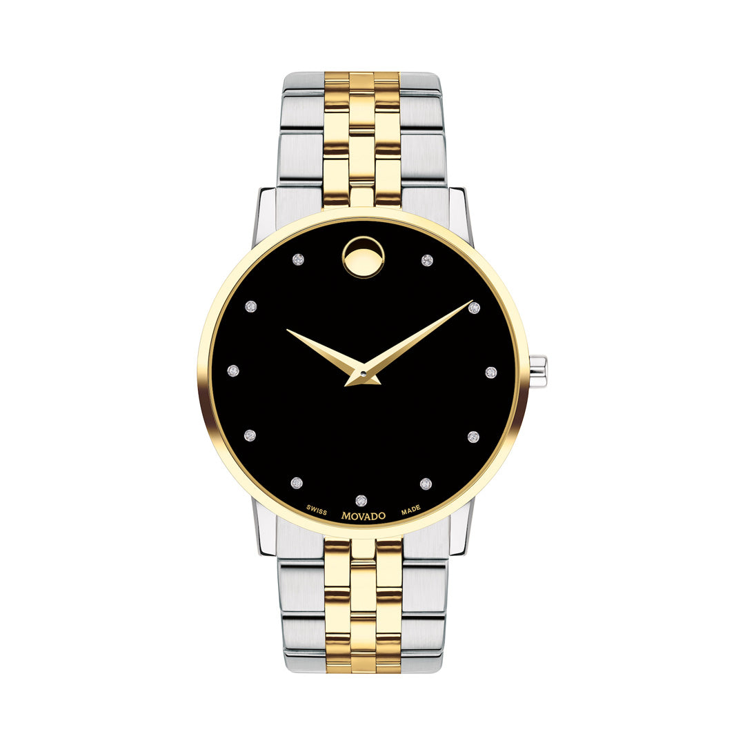 Two-tone watch with gold and silver band on a white background