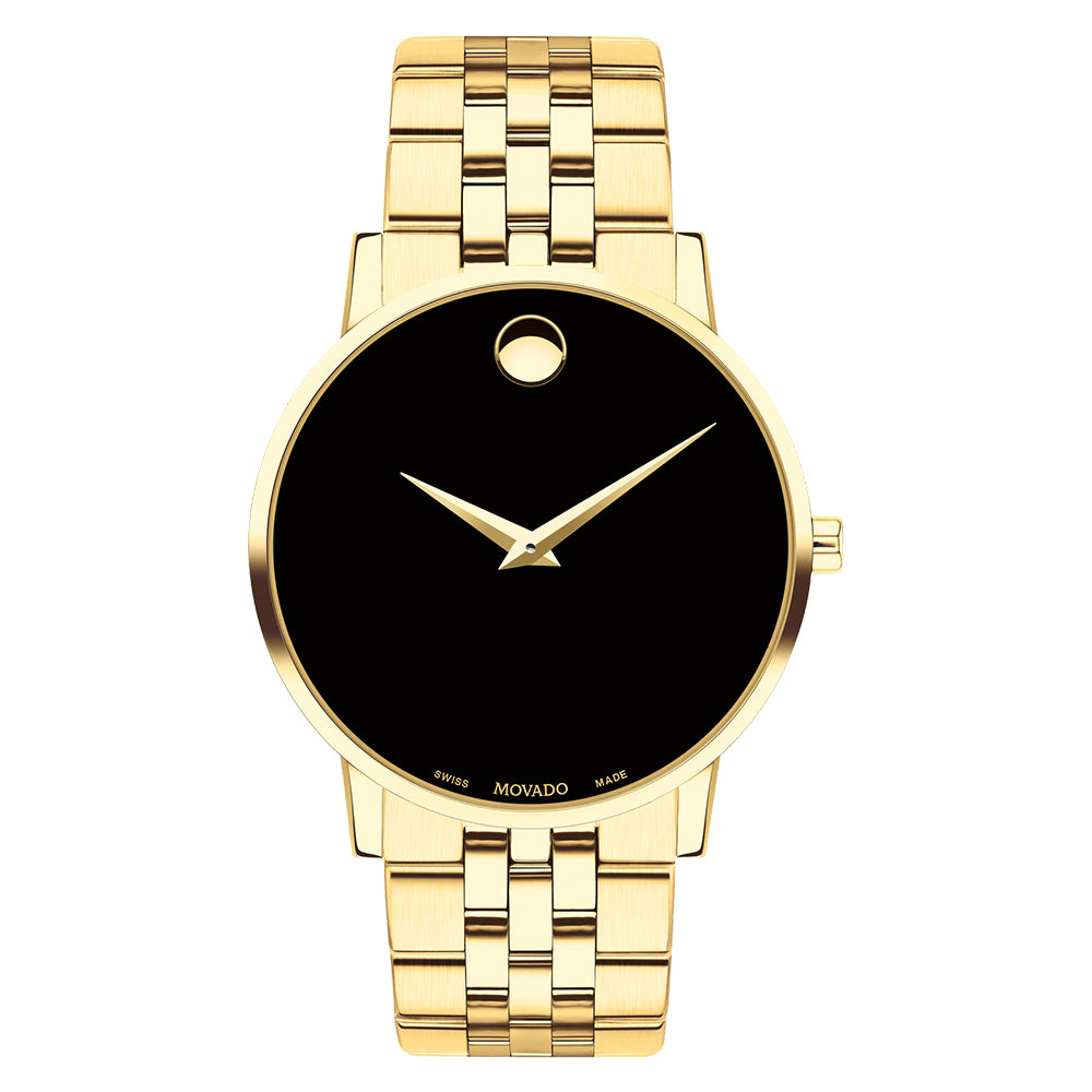 Gold wristwatch with black face on a white background