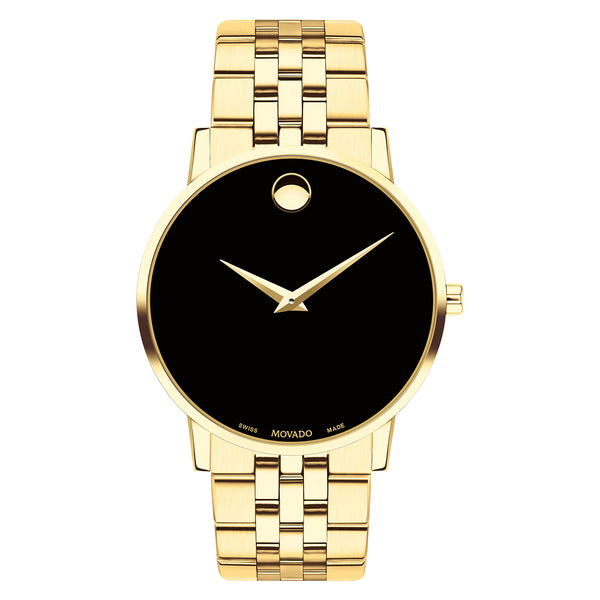 Gold wristwatch with black face on a white background