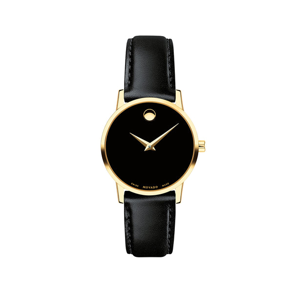 Black watch with gold case and black leather strap on a white background