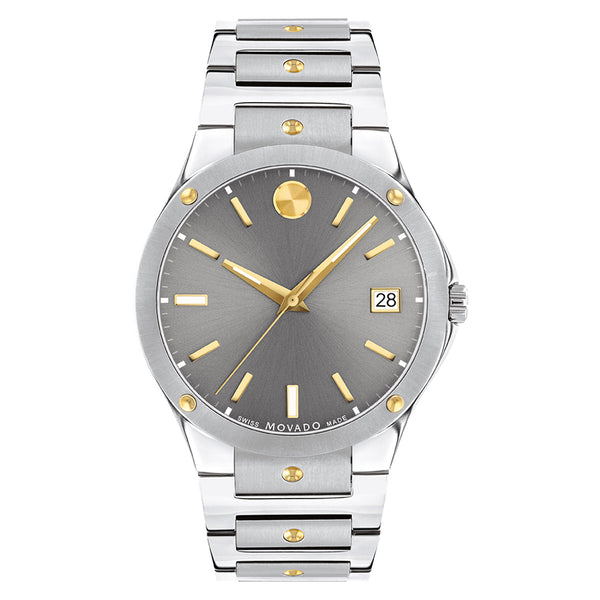 Silver and gold watch with gray dial on a white background