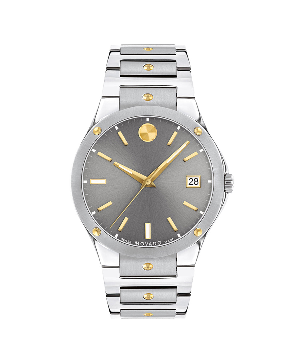 Silver and gold watch with gray dial on a white background