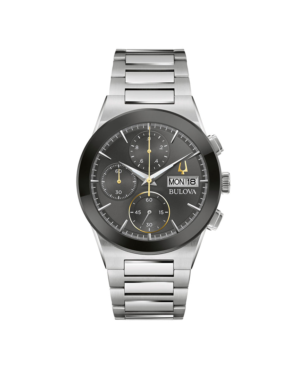 Bulova watch with silver bracelet and black dial on a white background