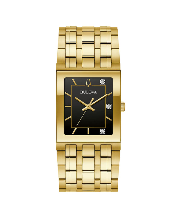 Gold watch with black face on a white background