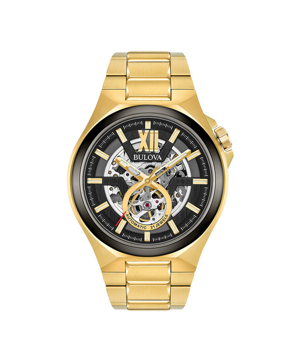 Gold watch with black face on a white background