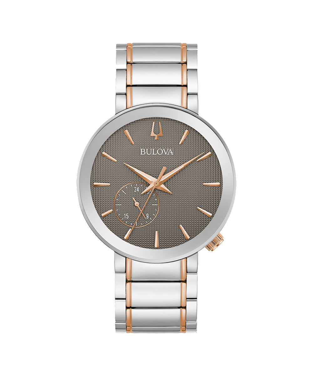 Bulova watch with silver and rose gold band on a white background