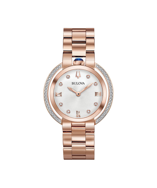Rose gold Bulova watch with a white face on a white background