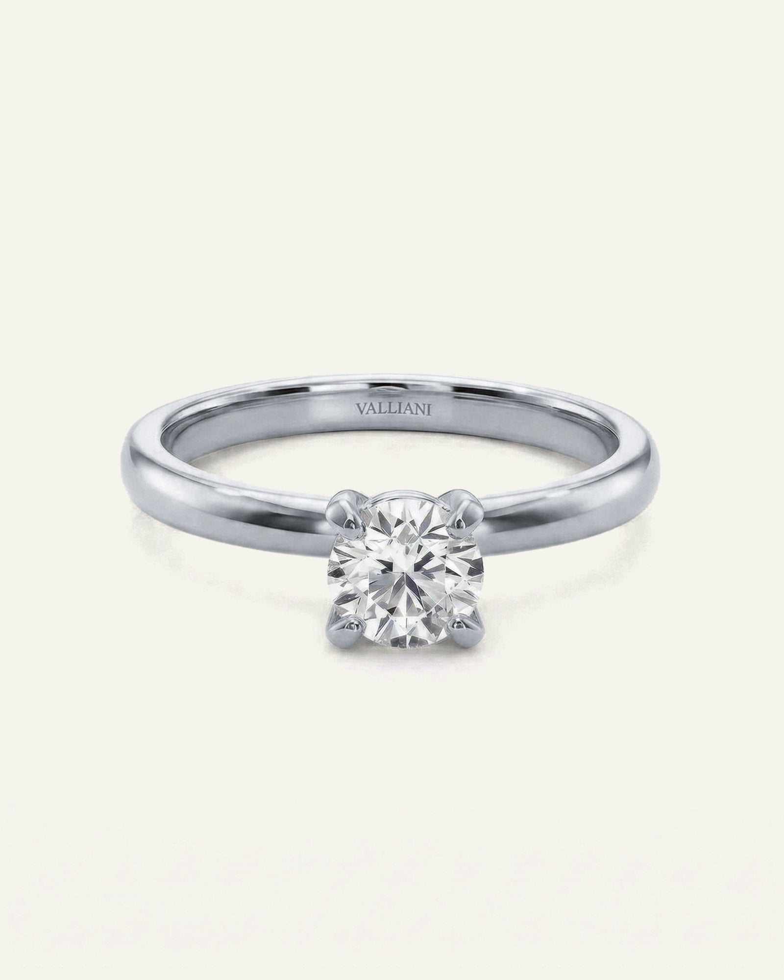 Diamond ring with 'Vallendi' branding on a white background