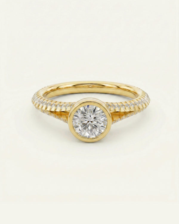 Gold ring with a diamond on a light beige background