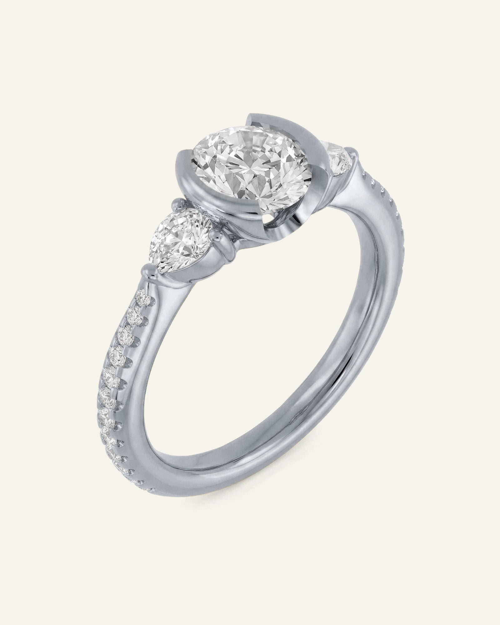 Diamond ring with a white gemstone on a light gray background