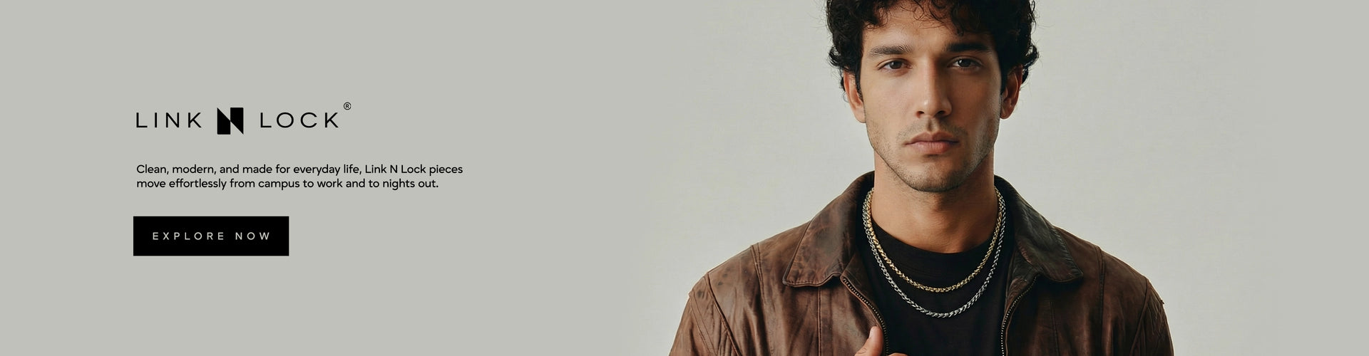 Man wearing a brown jacket with 'Link Lock' branding on a gray background