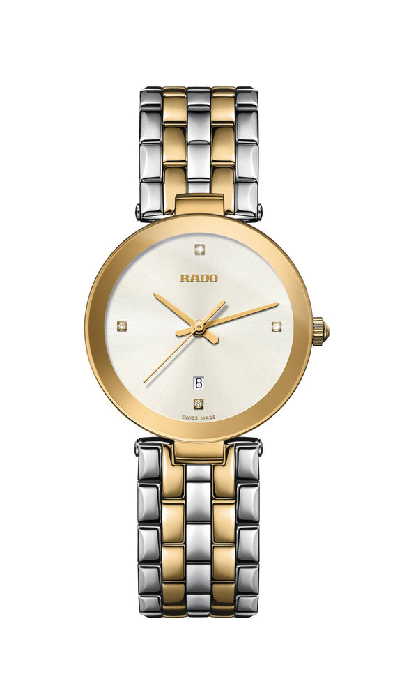 Two-tone watch with gold and silver band on a white background